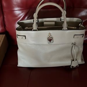 A large handbag.  It has double handles and a shoulder strap.